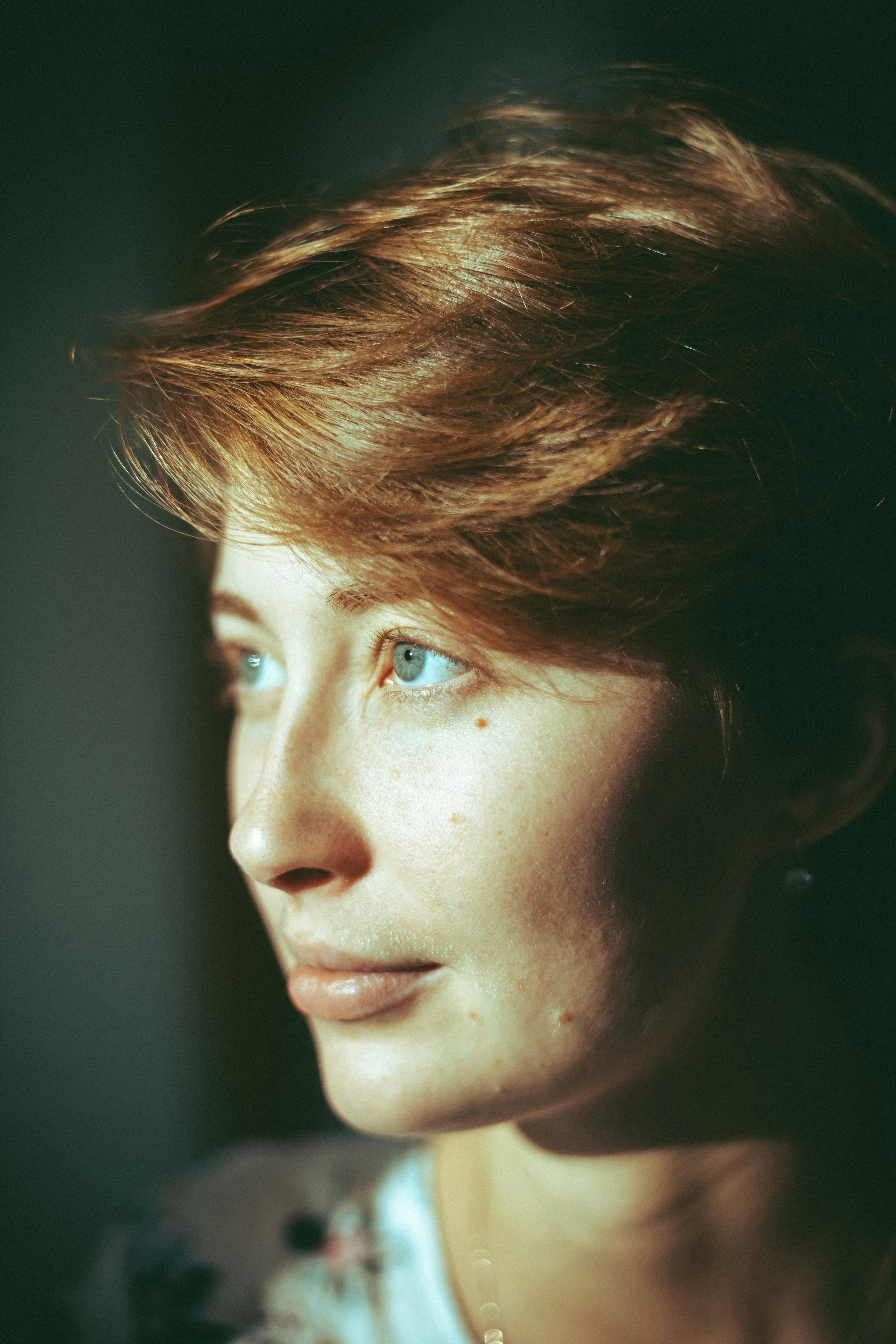 brown haired woman looking up